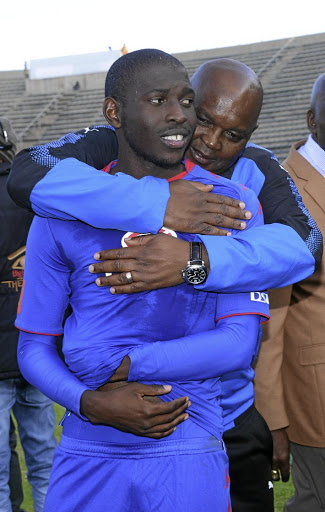 Mamelodi Sundowns coach Pitso Mosimane embraces SuperSport United player Aubrey Modiba. /Frennie Shivambu/Gallo Images