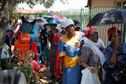 Social grants recipients queue to collect their their grant money in Soshanguve near Pretoria in Tshwane.