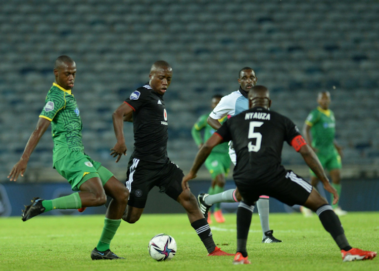 Orlando Pirates' Ben Motshwari (centre) competes for the ball in the DStv Premiership match against Baroka FC at Orlando Stadium in Johannesburg on December 2 2021.