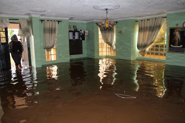 Walls of a sitting room are reflected after it flooded in Varsityville Estate, Ruiru on December 5, 2019.