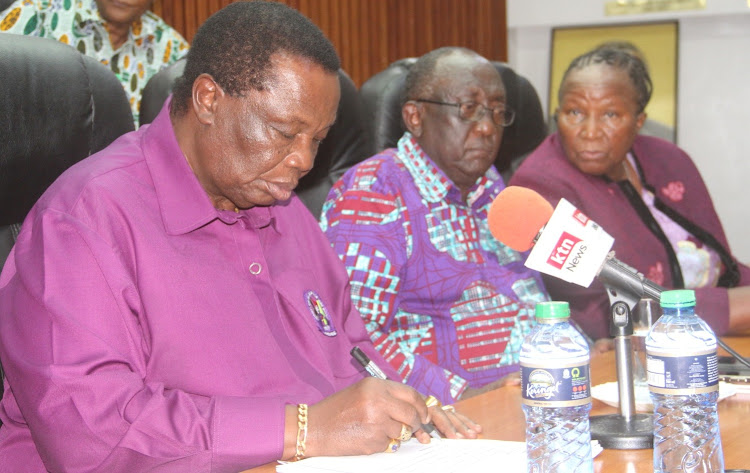 COTU boss Francis Atwoli with the newly elevated chairman of the movement Reverend Joel Chebii (C) during a union meeting