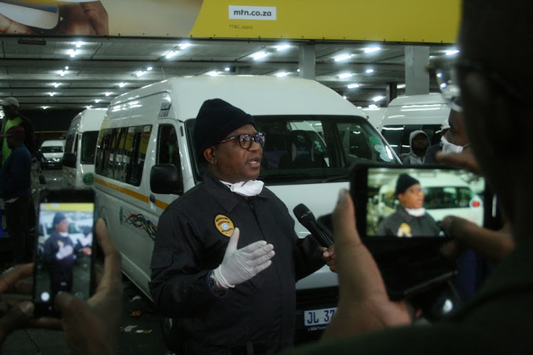 Transport minister Fikile Mbalula announces Covid-19 measures at the Bree Street taxi rank in Johannesburg earlier this week. From Saturday, taxis and buses will have to return to operating in morning and afternoon peak times only.