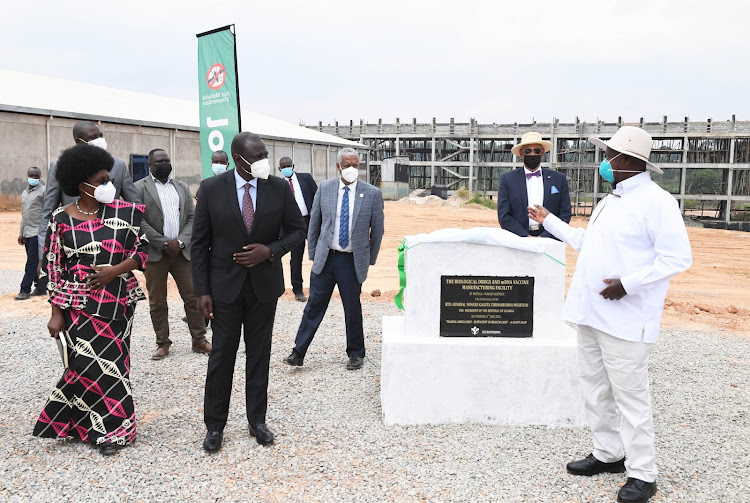 Deputy President William Ruto with President Yoweri Museveni during the laying of the foundation stone for the construction of the biological drugs and mRNA vaccine manufacturing facility in Matugga, Wakiso District, Uganda on July 6, 2021.