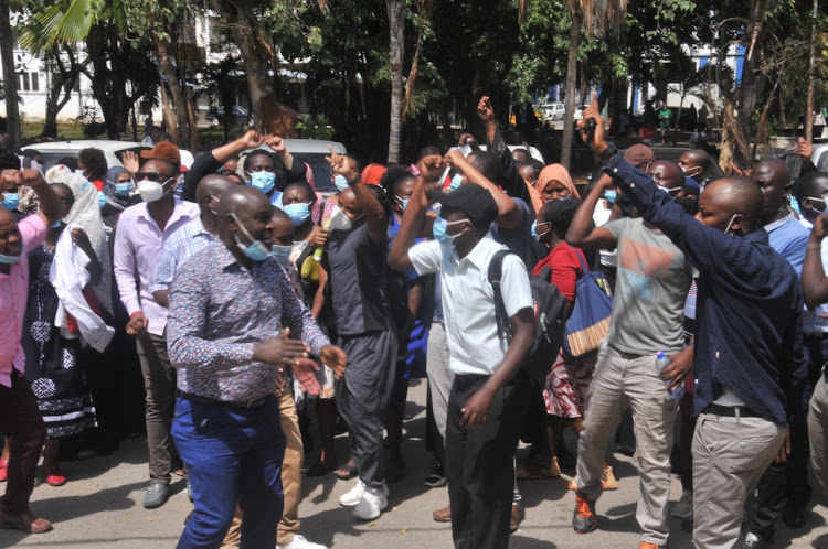 Mombasa health workers protest outside the county assembly over two-month salary delays in January.