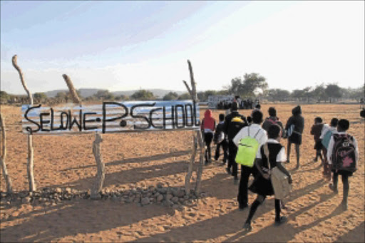 NEW DAWN: Pupils at Selowe Primary School at Silvermine village in Limpopojoin the assembly before the start of lessons. PHOTO: ELIJAR MUSHIANA