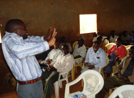 GET OUT: Mwingi traders sacco chairman Julius Mutukaa addresses a public meeting at Kiomo in Mwingi Central district in January. Photo/ Musembi Nzengu