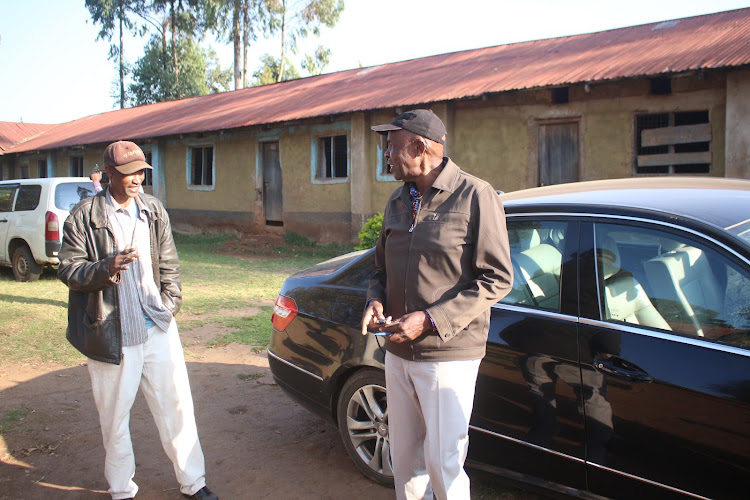 UDA candidate Ezekil Machogu arrives at Mesabisabi priary school where he voted