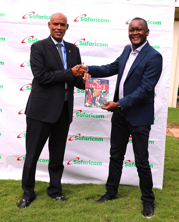 DCI Director Mohamed Amin receiving DCI Magazine Head Route to Customer Safaricom PLC James Kiama on June 21,2023.