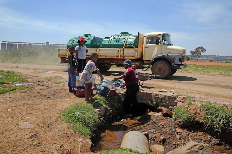 Zithobeni residents do their washing near the Bronkhorstspruit water purification plant. File photo.