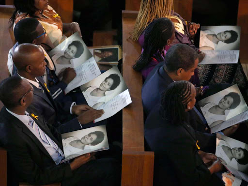 MourMourners read the programme during the Requiem Mass for former First Lady Lucy Kibaki at Consolata Shrine in Westlands, Nairobi, yesterday /JACK OWUORners follow the requiem mass proceedings of former First Lady Lucy Kibaki at Consolata Shrine in Westlands in Nairobi on May 4, 2016. Photo/Jack Owuor