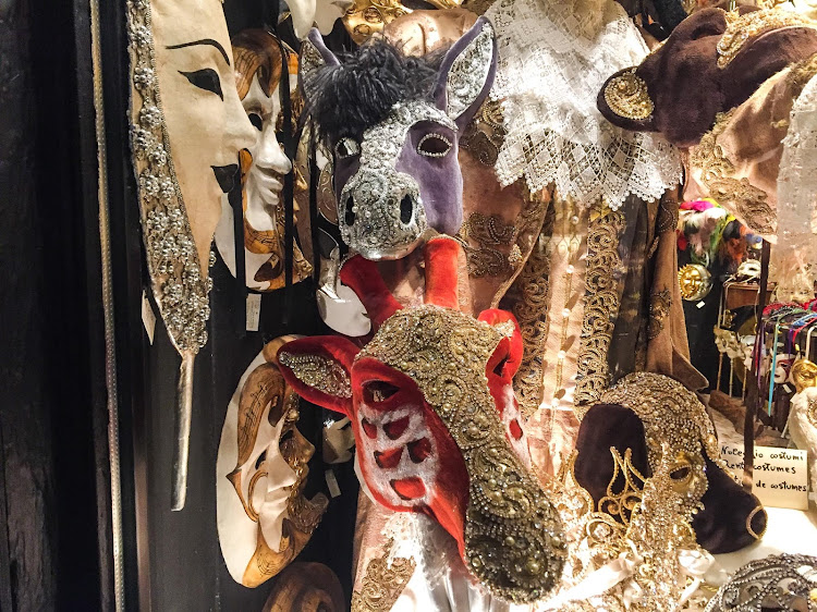 Animal masks in a shop window along the Procuratie Vecchie on Piazza San Marco, Venice. 