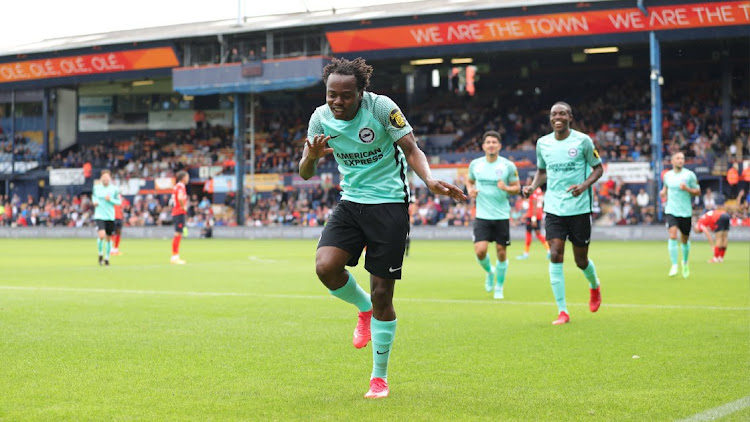 Percy Tau celebrates scoring for his side Brighton & Hove Albion.