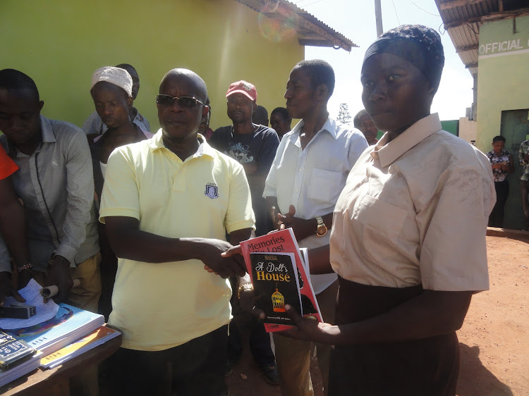 Matuga MP Kasim Tandaza gives learning material to the needy high school students in Kwale, in January 2020.