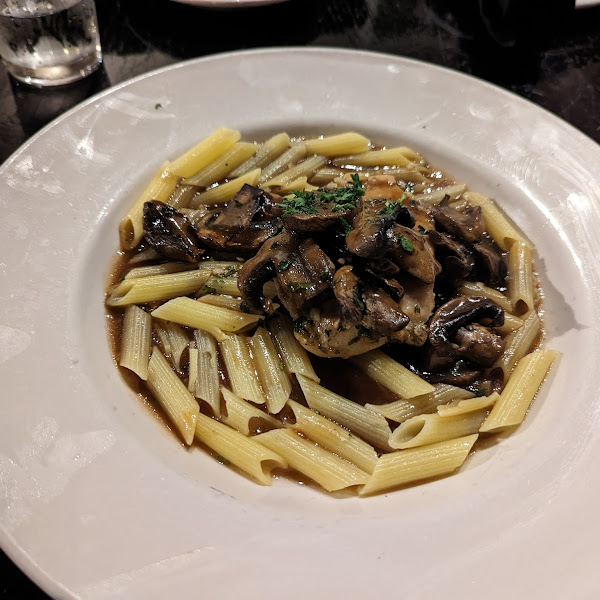 I think this was Marsala: chicken in wine sauce with mushrooms and GF penne pasta