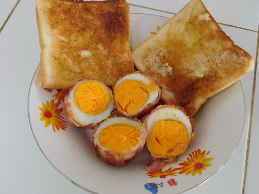 Baked Bacon Eggs with buttered toast.