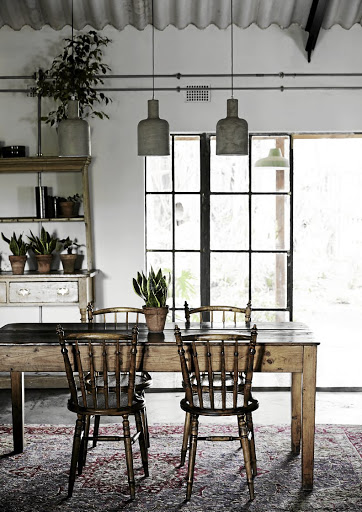 The dining room table is from Tina’s family house and the pendant lights are from Mr Price Home. They bought the Persian rug on auction from a local carpet shop.