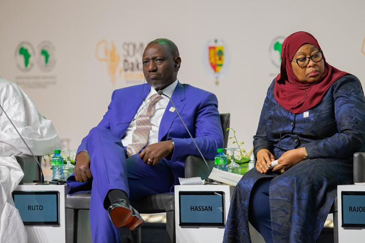 President William Ruto with his Tanzanian counterpart Samia Hassan at the Dakar 2 Summit - Feed Africa on January 25, 2023.