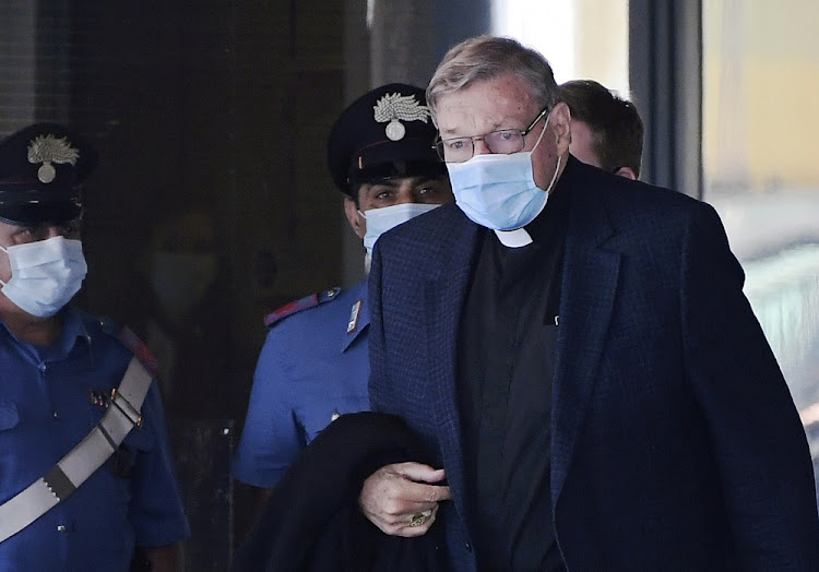 Former Vatican treasurer George Pell arrives after travelling for first time since he was acquitted of child sex abuse charges in Australia, at Rome's Fiumicino Airport, on September 30, 2020.