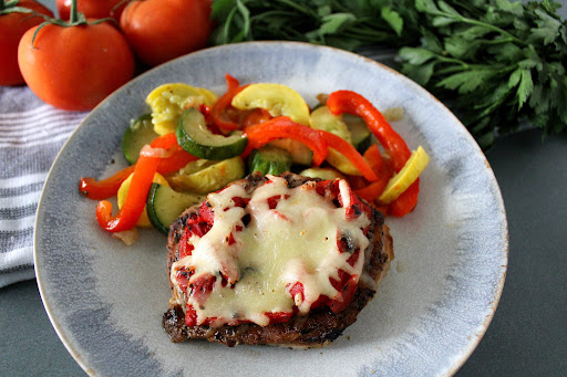 Grilled Italian Pork Chop on a plate.