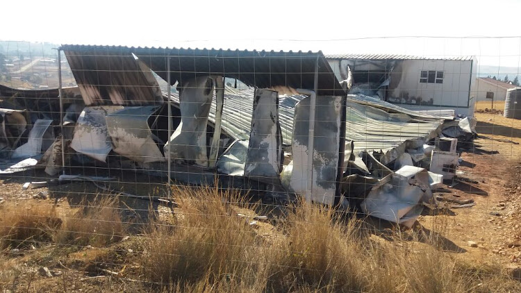 The remains of the torched library in Ixopo, after protesters went set fire to the facility on Sunday night.