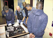 FILE PHOTO: Police count the number of mandrax tablets  in front of a suspect after a successful drug bust. Photo: SUPPLIED