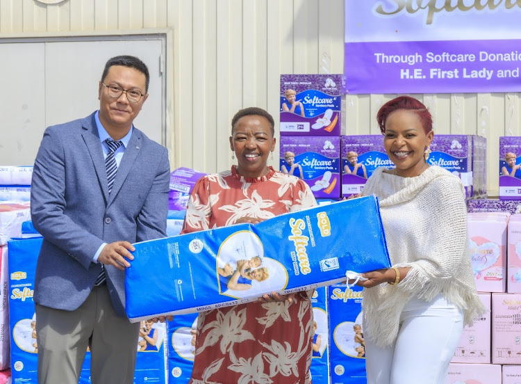 Sunda International Kenya's CEO Tom Li, First Lady Rachael Ruto and Softcare brand ambassador Linet Munyali, aka Size 8, during softcare sanitary pads and diaper factory grand breaking in Athi River, Machakos county, on Thursday, March 21, 2024.