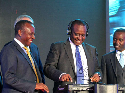 Telkom Kenya chairman Eddy Njoroge, Treasury CS Henry Rotich and his ICT counterpart Joe Mucheru during the launch of the company’s new brand identity in Nairobi yesterday /ENOS TECHE