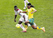 MOMENT OF TRUTH: SA's Siphiwe Tshabalala and Mali's Issaka Samake tussle for the ball during their drawn game on Wednesday. Tonight Bafana need only a draw against Nigeria to progress to the quarterfinals. Picture: ESA ALEXANDER