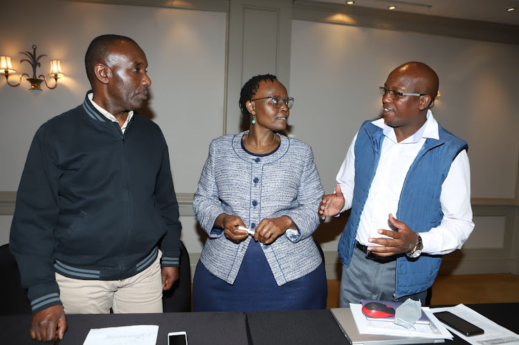 Association of Kenya Feed Manufacturers (AKEFEMA) secretary general Martin Kinoti, Open Forum on Agricultural Biotechnology (OFAB-Kenya) chairperson Margaret Karembu and Kiambu County Poultry Farmers Association coordinator Zachary Munyambu during a joint press briefing on lifting on ban on GMOs at Norfolk Hotel, Nairobi on October 12.