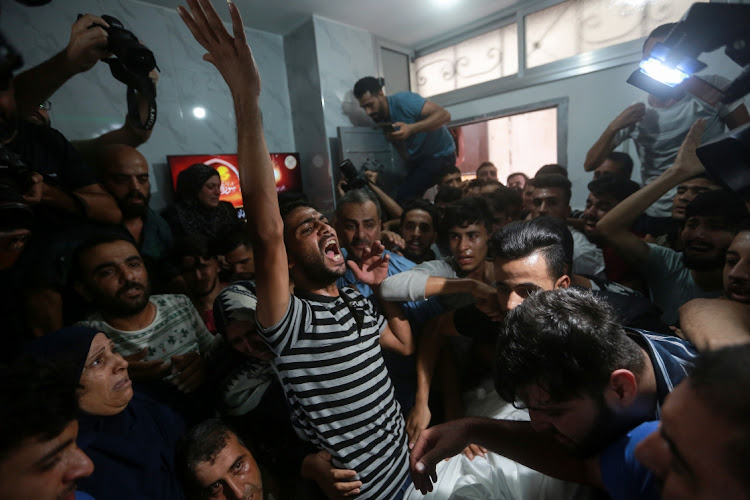 Mourners attend the funeral of Khalil Abu Hamada, 19, who was killed in an Israeli air strike, in Jabalia in the northern of Gaza Strip, August 7 2022. Picture: REUTERS