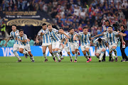 Argentina's players celebrate the fourth and winning penalty by Gonzalo Montiel in the penalty shootout in the Fifa World Cup Qatar 2022 final against  Argentina at Lusail Stadium in Lusail City, Qatar on December 18 2022. 