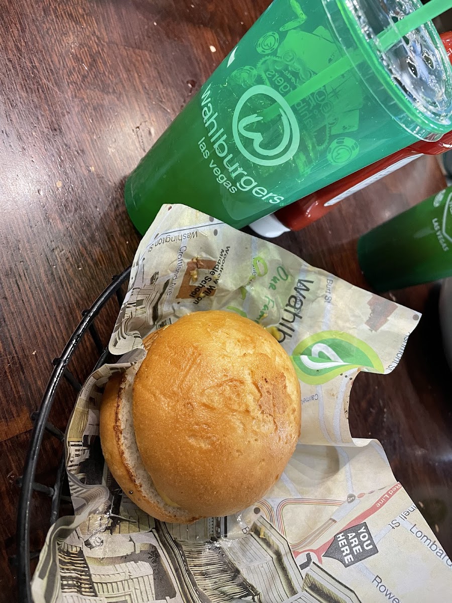 Gluten free bun and a turkey burger patty.