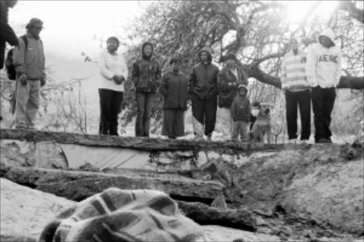 DISBELIEF: Residents of Landida in Stellenbosch are shocked after two men were found dead because a concrete floor collapsed on them. Photo: SABELO MPANA