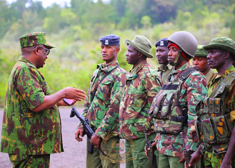 Inspector General of Police Japhet Koome has a word with security officers during his first day tour of Baringo on April 2, 2024.