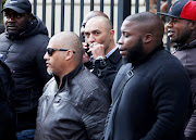 Nafiz Modack and his bodyguards outside Cape Town regional court during a previous appearance.