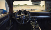 The cockpit of the 911 GT3. Notice the 9,000rpm redline. 