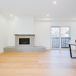 Modern fireplace in living room with ledges on both sides