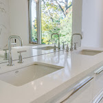 Modern floating double sink vanity in master bathroom