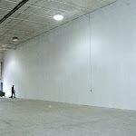 Painting a large area in an industrial setting with white paint