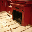 Foam insulation applied in between floor joist;
shown area around fireplace