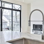 Open concept kitchen with TCE stone quartz and a modern kitchen faucet
