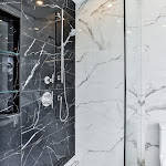 Modern walk in shower with glass enclosure