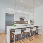 Modern kitchen with caesarstone countertop and white cabinetry