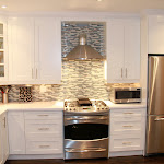 Glass Tiles Backsplash creates very elegant look to newly renovated kitchen