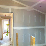 Nearing completion of home renovation with sanding, taping and drywall