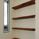 Modern wooden plank shelves and long window installation