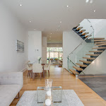 Living area along with dining room and white oak hardwood flooring