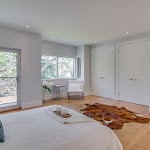 Master Bedroom with white oak hardwood flooring and white closet doors