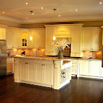 'L' shaped cabinets & appliances
with middle isle, white color