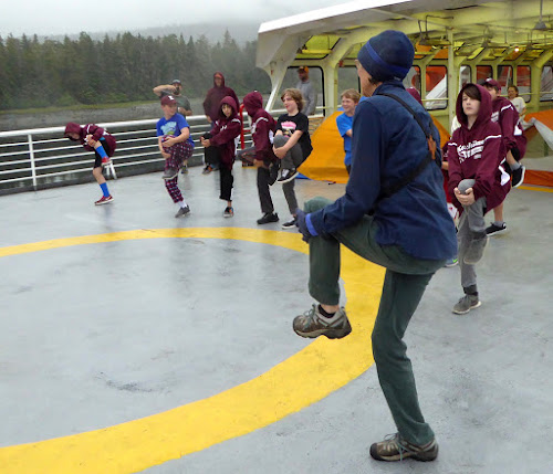 Doing morning exercises on ferry